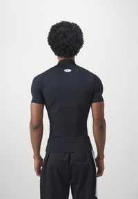Under Armour - Koszulka sportowa