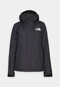 Schwarze wasserdichte Jacke mit verstellbarer Kapuze, zwei mit Reißverschluss versehenen Taschen und Belüftung. Mit Logo auf der Brust und elastischen Bündchen für einen sicheren Sitz.