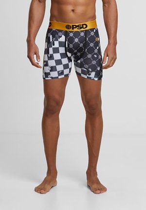 Zwart-witte boxer shorts met een ruitpatroon en een gele PSD tailleband. Van elastisch materiaal met een strakke pasvorm, lengte tot halverwege de bovenbenen.
