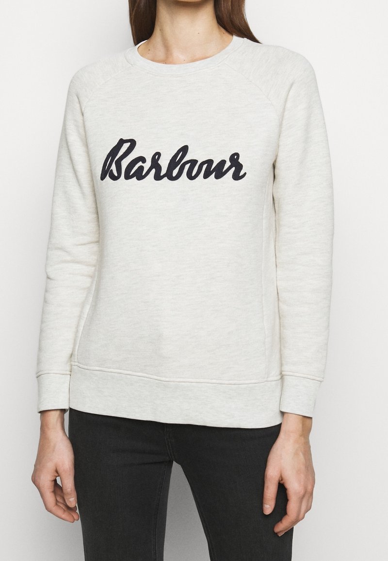 Krémová mikina z měkké látky, s černě vyšitým logem "Barbour", s žebrovanými manžetami a lemem.