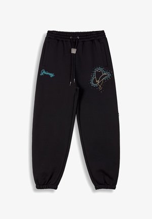Black jogger pants made of soft fabric, featuring an elastic waistband with drawstring, side pockets, and colorful embroidery on the left thigh.