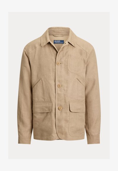 Men’s beige linen jacket with collar, three front buttons, one chest pocket, and two flap pockets at waist level.