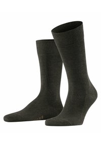 Calcetines de algodón verde oscuro con puños acanalados, una textura suave y puntera reforzada. Presenta un logotipo sutil cerca del talón en un color contrastante.
