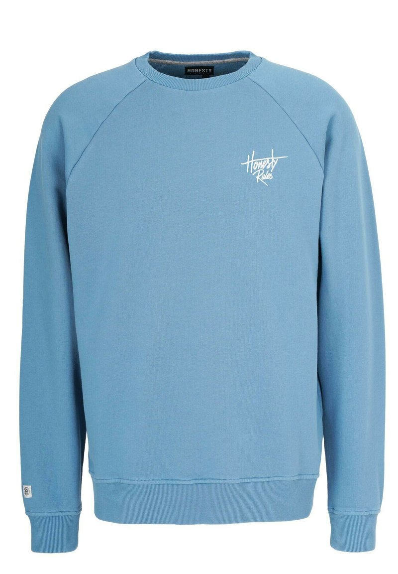 Valkoinen huppari, joka on valmistettu puuvillasekoitteesta, jossa on raglan-hihat, ribattut hihansuut ja valkoinen "Honesty Rules" -logo rinnassa.