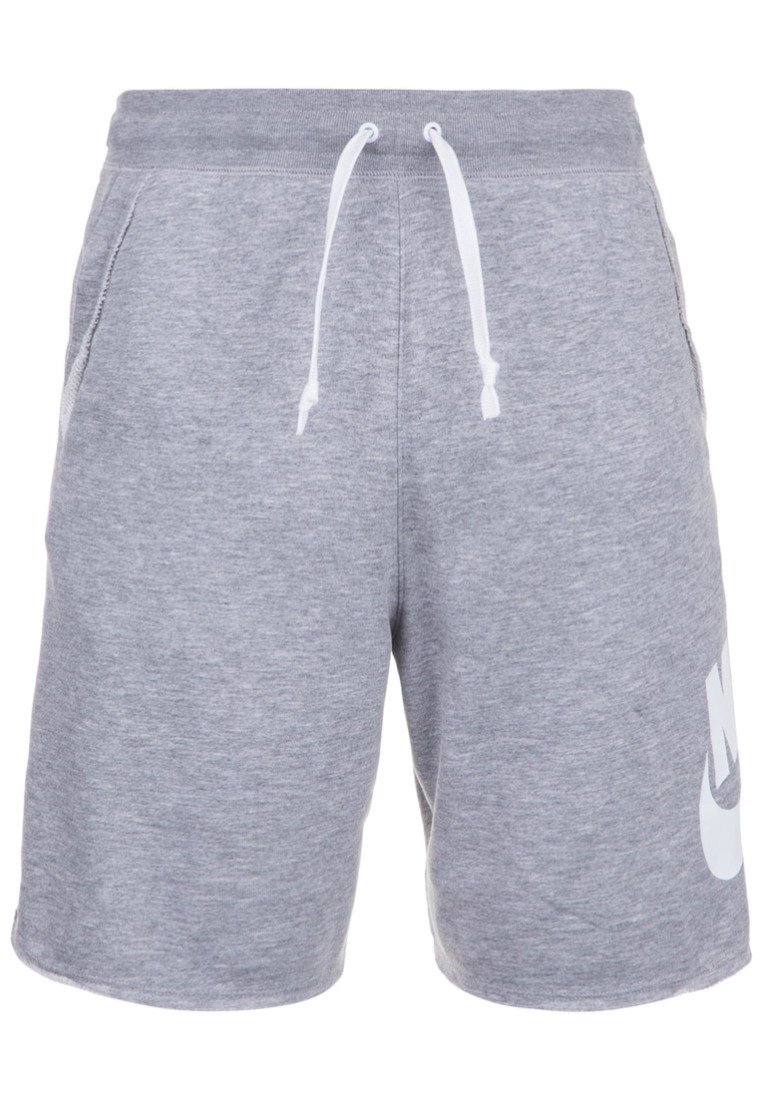 Šedé sportovní šortky z bavlny s vázací šňůrkou v pase, bočními kapsami a velkým bílým logem Nike na spodní levé noze.