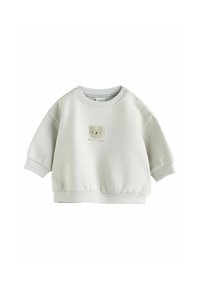 Ljust grå sweatshirt med en texturerad björns ansikte broderat. Har rund halsringning och elastiska ärmslut och fåll för komfort.