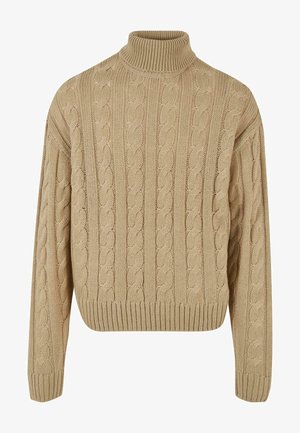 Bežinis mezginys megztinis su aukštu kaklu ir banguota apačia. Savybės – tekstūruotas raštas ir kritusios pečių siūlės, užtikrinančios laisvą konstrukciją.