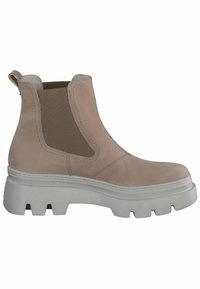 Bottine en cuir beige avec des panneaux latéraux en élasthanne, semelle épaisse blanche et bout rond. Finition texturée avec des détails de couture.