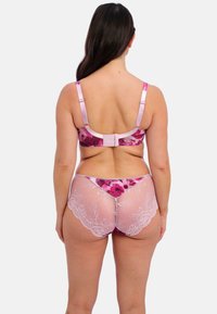 Floral-printed pink bra with adjustable straps and back closure; matching sheer pink panties with lace detailing at edges.