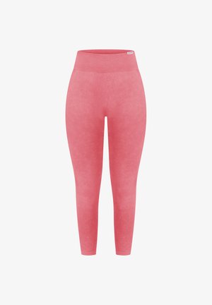 Leggings rose taille haute fabriqués en tissu extensible et lisse. Présentent un design élégant avec une taille côtelée et sans coutures visibles.