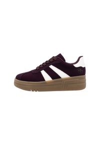 Purple suede sneakers with white stripes and brown rubber sole. Features rounded toe, lace-up front, and textured accents on the sole.