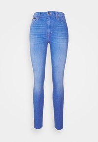 Jeans ajustados en denim azul claro, con una cintura alta, diseño de cinco bolsillos y un sutil efecto desgastado. Cierre de botón metálico estándar.