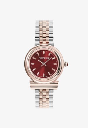 Hodinky Ferragamo s kulatým burgundským ciferníkem, růžově zlatým rámečkem, kovovým náramkem ze stříbra a růžového zlata a charakteristickými hodinovými indexy.