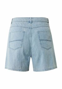 Světle modré džíny s rovnym střihem, mají dvě zadní kapsy a viditelné švy na kapsách a pase.