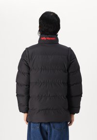 Helly Hansen YU MODULAR PUFFER JACKET UNISEX - Zimska jakna - black