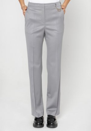 - Spodnie materiałowe