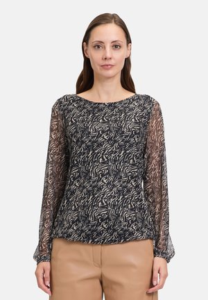 Schwarz-beige gemusterte Bluse mit langen, durchsichtigen Ärmeln, rundem Ausschnitt und lockerer Passform. Der Stoff weist ein strukturiertes, fließendes Design auf.