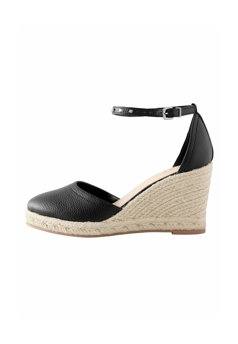 Black leather wedge shoe with a smooth finish, open toe, and adjustable ankle strap. Jute-wrapped midsole features a textured pattern.