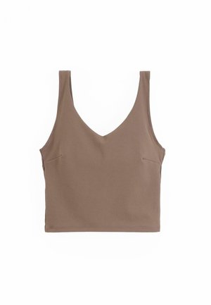 Brown sleeveless top with a v-neck, made of smooth fabric. Features a fitted design and a pocket on the left side.