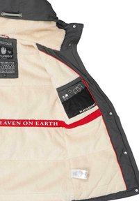 Gray coat interior lined with cream fleece, featuring a red "HEAVEN ON EARTH" label and zippered pocket with black detailing.