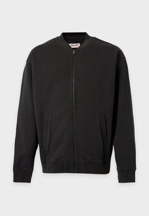 Blouson bomber noir à fermeture zippée sur le devant, avec col, poignets et ourlet côtelés, et deux poches avant, présenté sur un fond uni.