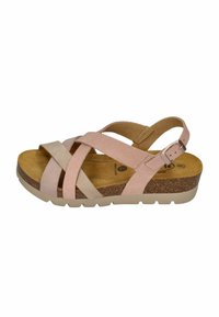 Cross-strap sandal featuring light pink and beige suede, cork footbed, adjustable ankle strap, and a sturdy beige rubber sole.