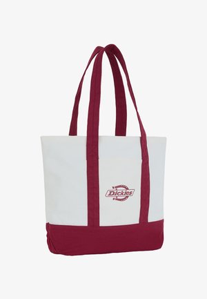 Plátěná taška s vínovými rukojetmi a spodní částí, bílým tělem a logem Dickies na přední centrální kapse.