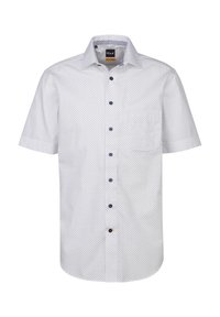 Camicia a maniche corte, con bottoni, in tessuto bianco con un delicato motivo a pois blu navy. Caratterizzata da un colletto classico e una tasca sul lato sinistro del petto.