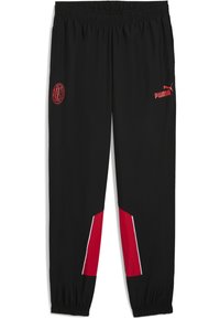 Pantalons de sport noirs avec accents rouges. Dotés d'une taille élastique, d'un logo Puma rouge et d'un blason de l'AC Milan. Matière lisse et légère.