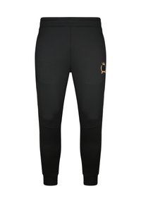 Pantalon de jogging noir fuselé avec poignets côtelés et petit blason doré brodé sur la partie supérieure de la cuisse gauche.