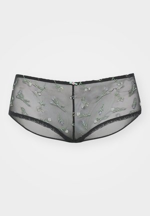 Juodos tinklinės berniukų šortai, papuošti žaliais ir purpuriniais siuvinėtais gėlėmis. Baigti juodu nėriniu aplink kraštus.