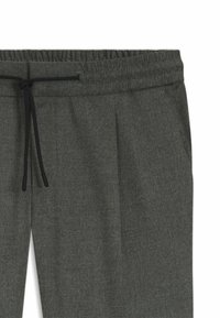 Dark grey sweatpants with an elastic waistband, drawstring closure, and side pockets, featuring a soft, textured fabric.