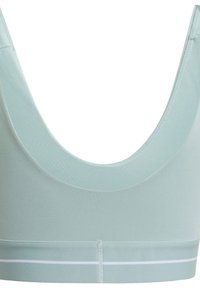 Light green sports bra with a wide, scooped back. Made of smooth fabric with a white band at the bottom. Features clean seams and no hardware.