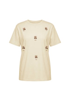 Beżowy t-shirt z krótkim rękawem z sześcioma małymi brązowymi aplikacjami misiów, ozdobionymi kokardkami, równomiernie rozmieszczonymi z przodu.