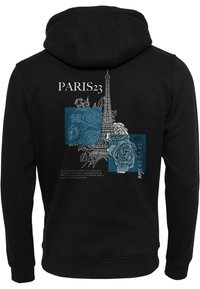 Black hoodie featuring a white sketch of the Eiffel Tower, blue roses, and text "PARIS 23" with additional French text and blue accents.