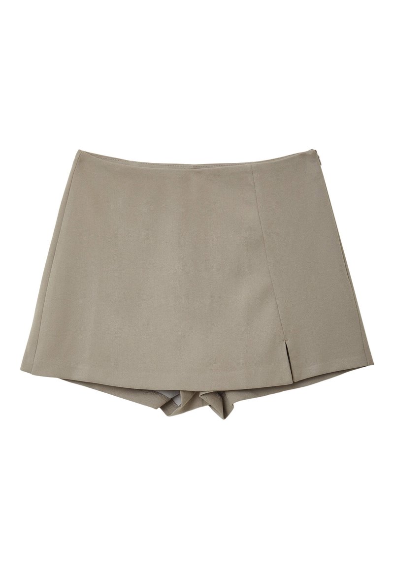 Gonna corta beige con un design sartorial, caratterizzata da una texture liscia e leggere spaccature laterali. Realizzata in materiale leggero.