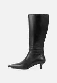 Black leather knee-high boot with a pointed toe and low kitten heel. Smooth texture and minimalistic design with subtle stitching details.