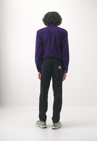 Carhartt WIP NEWEL PANT - Stoffhose - dark navy