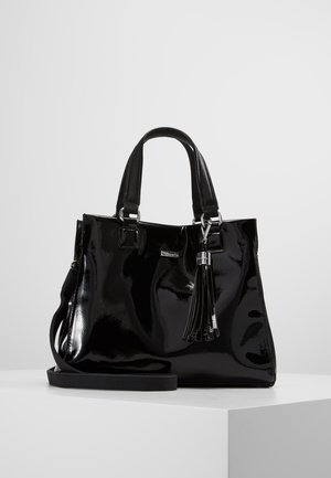 Black glossy handbag with double handles, a detachable shoulder strap, and a decorative tassel hanging on the front.