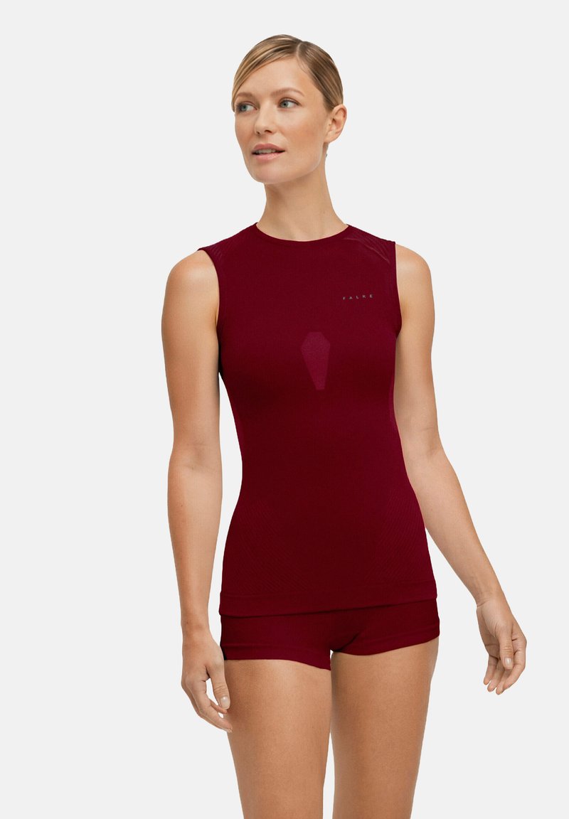 Bordeauxrotes Sporttop mit nahtlosem Design und figurbetonter Silhouette, kombiniert mit passenden Shorts. Verfügt über dezente Markenkennzeichnung auf der Brust.