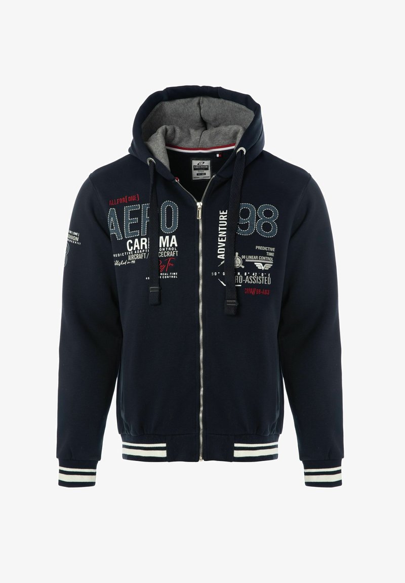 Sweat à capuche zippé bleu marine avec intérieur gris, présentant des accents à rayures blanches aux poignets et à l'ourlet. Texte décoratif et graphismes en plusieurs couleurs.