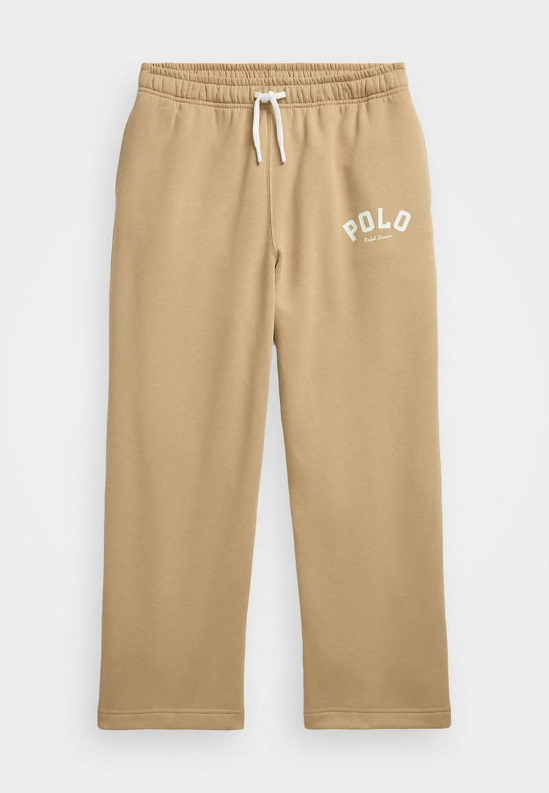 Bežinės sportinės kelnės, pagamintos iš minkštos medžiagos, su elastingu juosmeniu ir raišteliu, o viršutiniame kairiajame kampe yra baltas "POLO" logotipas.