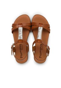 Brown leather sandals with a cross-strap design and a metallic silver accent. Adjustable ankle strap and cushioned insole.