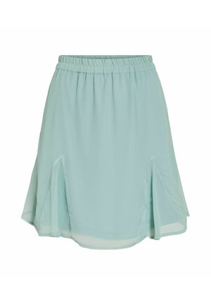 Jupe bleu clair, mi-longue, avec une taille élastique et des fentes sur les côtés. Fabriquée en tissu doux et léger au toucher lisse.