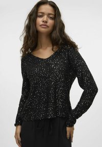 Maglione nero con vestibilità ampia e maniche lunghe, dotato di scollatura a barca e tessuto testurizzato decorato con paillettes luccicanti.