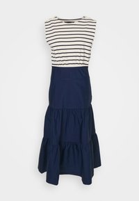 Vestido sin mangas con la parte superior a rayas horizontales en blanco y azul marino y falda corta azul marino con volantes, con detalles de botones en los hombros.