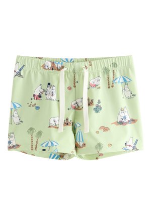 Lysegrønne shorts med hvide snore, dekoreret med tegneserie flodhest figurer på stranden under parasoller og palmer.