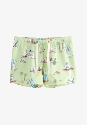 Lysegrønne shorts med hvide snore, dekoreret med tegneserie flodhest figurer på stranden under parasoller og palmer.