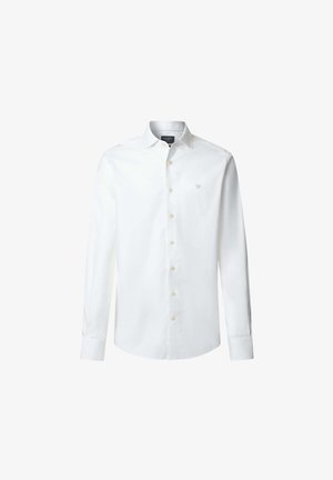 Vit långärmad skjorta i bomull. Har en knapp-down krage, framknappar och en liten broderad logotyp på bröstet.