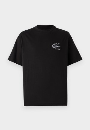 Black cotton t-shirt with short sleeves, round neckline, featuring a small white Calvin Klein logo on the left side of the chest.